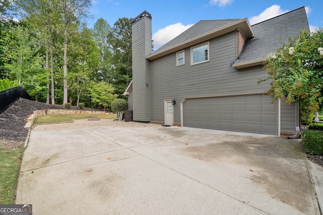 view of side of property with a garage