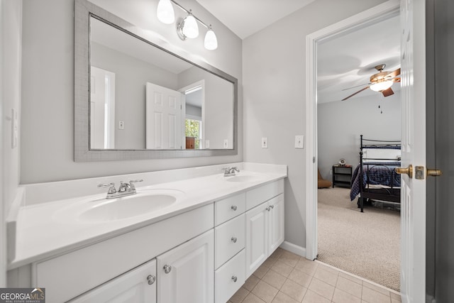 bathroom featuring tile patterned floors, ceiling fan, and vanity