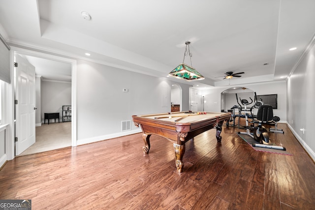 playroom with light hardwood / wood-style floors, ceiling fan, a tray ceiling, and pool table