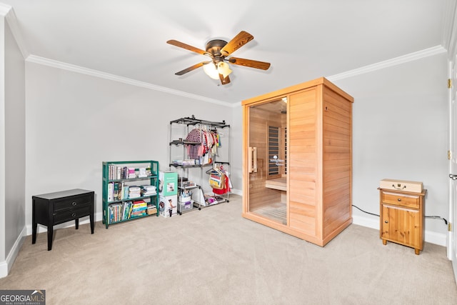 playroom with carpet flooring, ceiling fan, and ornamental molding