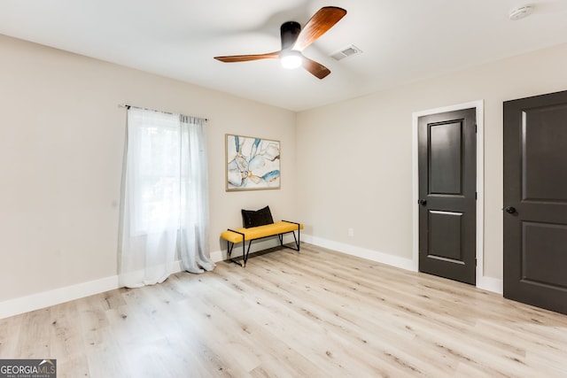 unfurnished room with ceiling fan and light hardwood / wood-style flooring