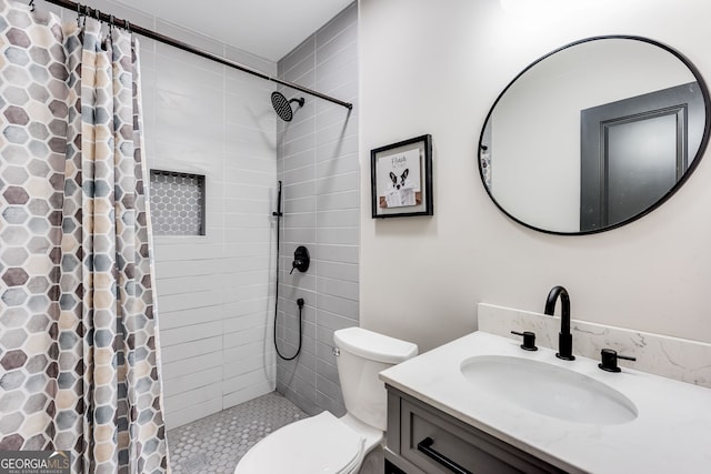 bathroom featuring a shower with curtain, vanity, and toilet