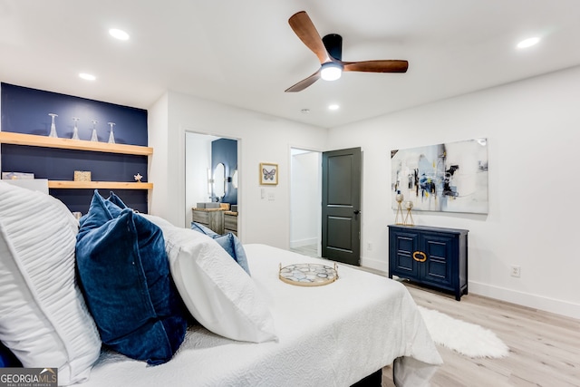 bedroom with ceiling fan and light hardwood / wood-style floors