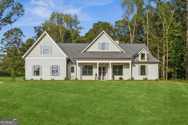 view of front of property with a front lawn and a porch