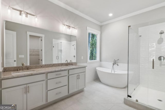 bathroom featuring vanity and separate shower and tub