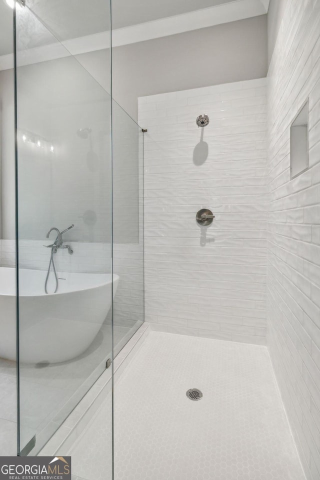 bathroom with shower with separate bathtub