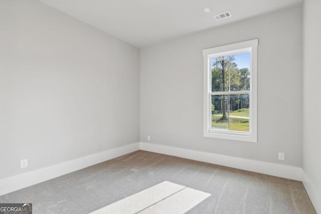 unfurnished room featuring carpet flooring