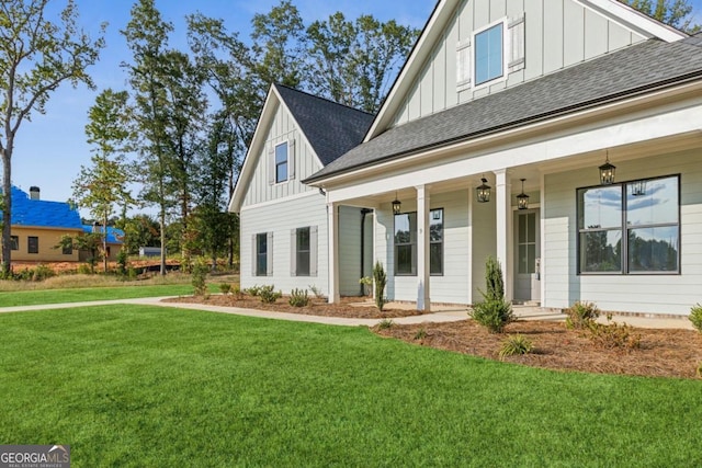 view of front of home featuring a front lawn and a porch