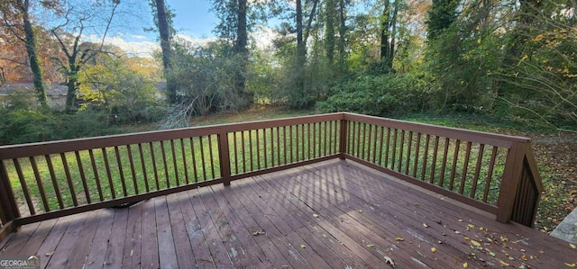 deck featuring a lawn