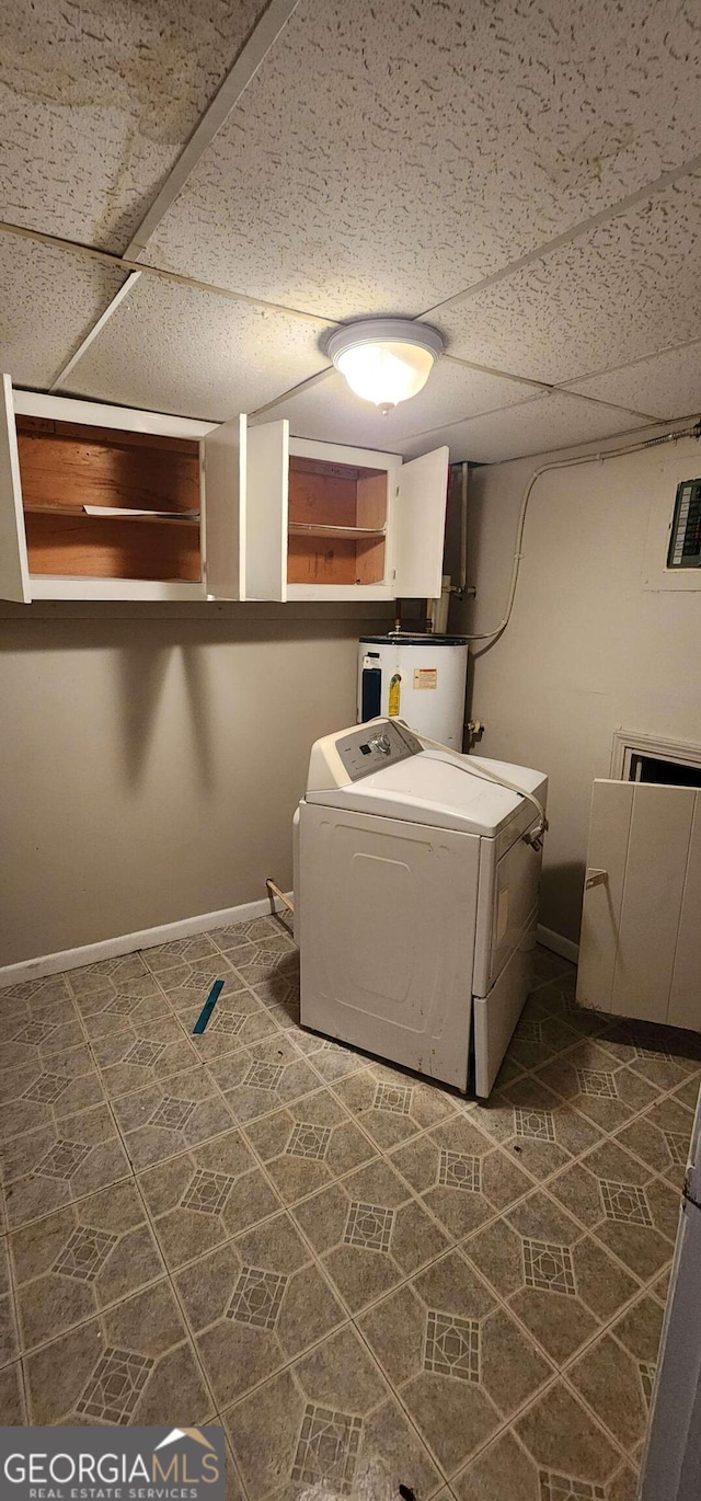 clothes washing area featuring washer / dryer and electric water heater