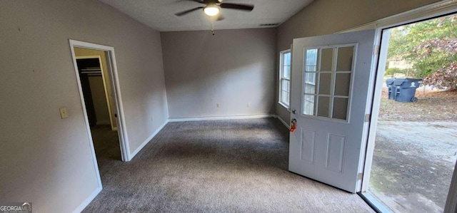 doorway to outside featuring carpet, ceiling fan, and lofted ceiling