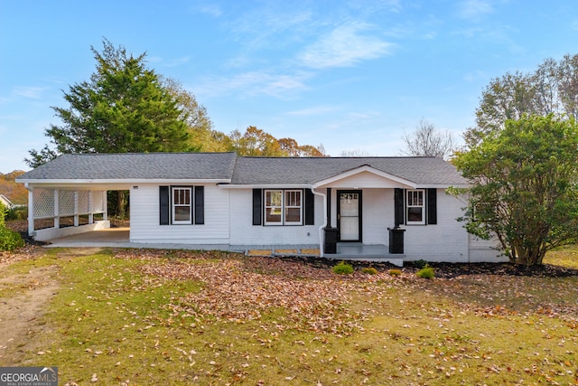 ranch-style house with a carport and covered porch