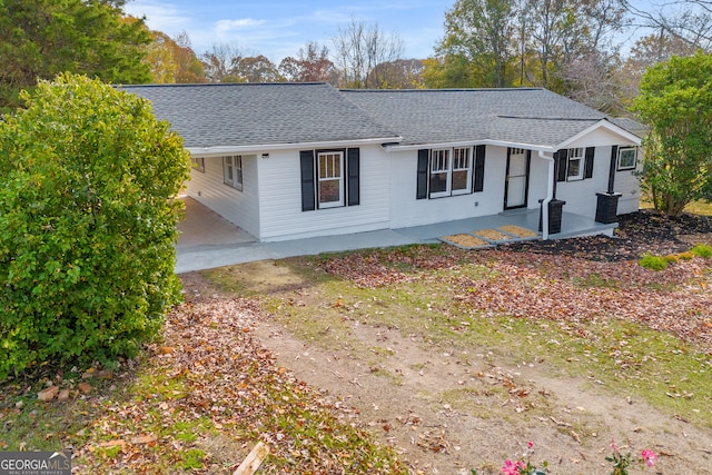 ranch-style home with a patio