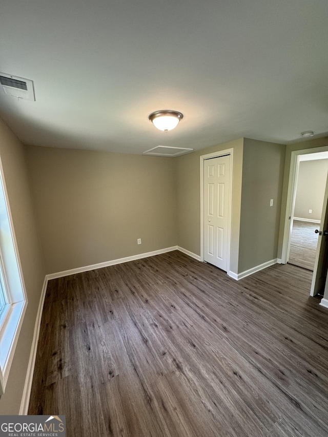 empty room with wood-type flooring