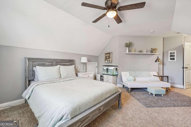 bedroom with ceiling fan, carpet floors, and lofted ceiling