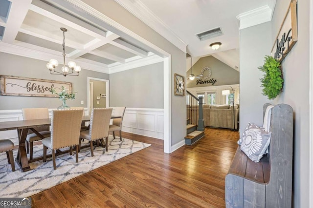 dining room with a notable chandelier, dark hardwood / wood-style floors, crown molding, and coffered ceiling