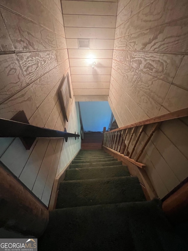 stairs with wood walls