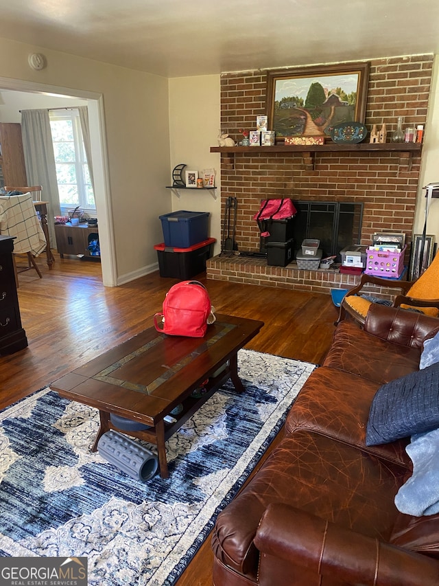 living room featuring hardwood / wood-style flooring and a fireplace