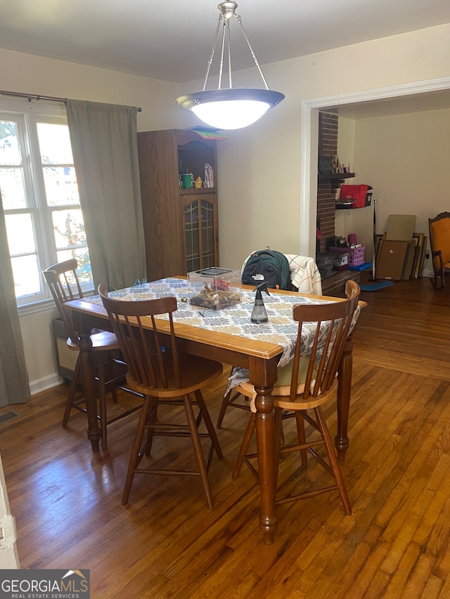 dining room with hardwood / wood-style flooring