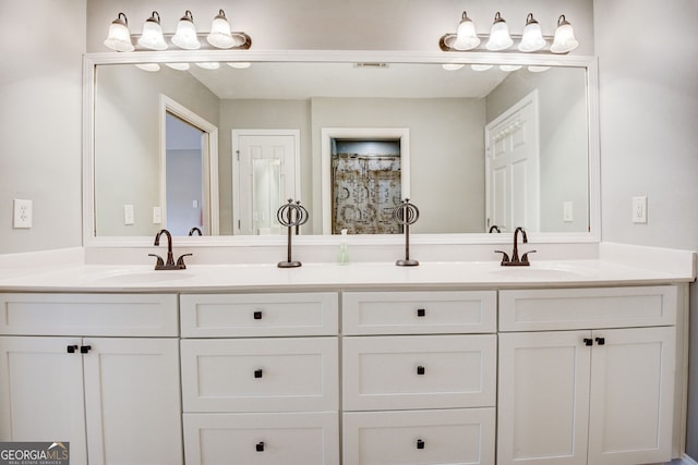 bathroom with a shower with shower curtain and vanity