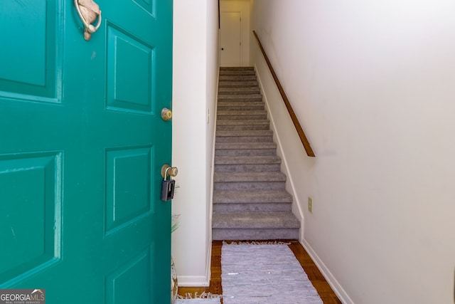 foyer with dark hardwood / wood-style flooring