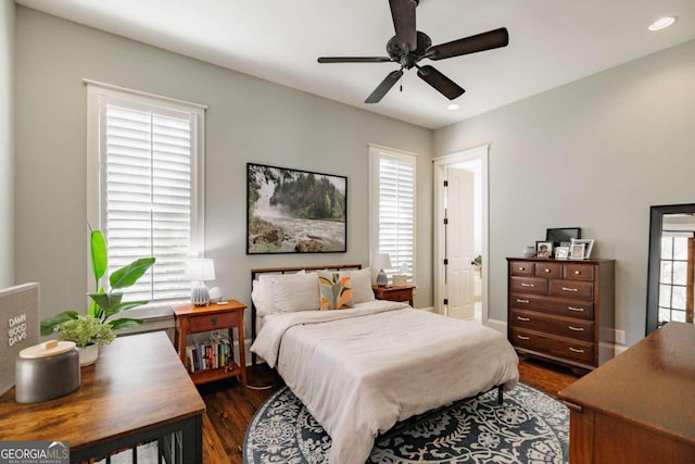 bedroom featuring dark hardwood / wood-style floors and ceiling fan