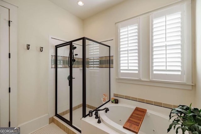 bathroom featuring tile patterned flooring and independent shower and bath