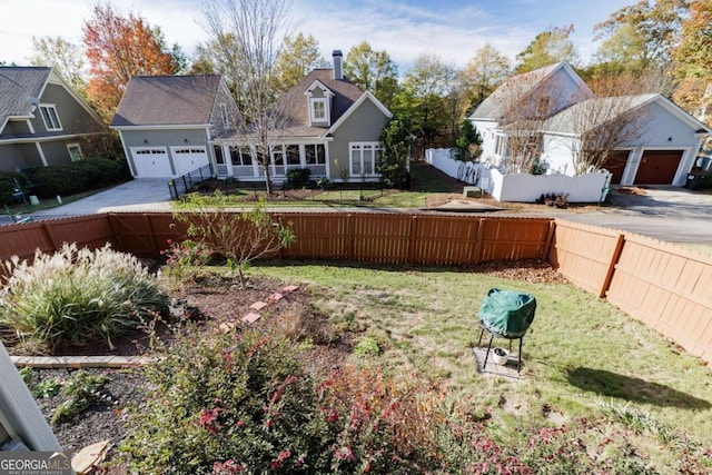 view of yard with a garage