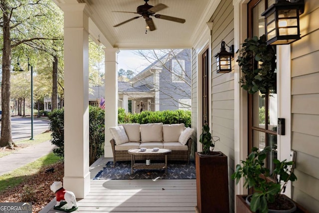 wooden terrace with ceiling fan and a porch