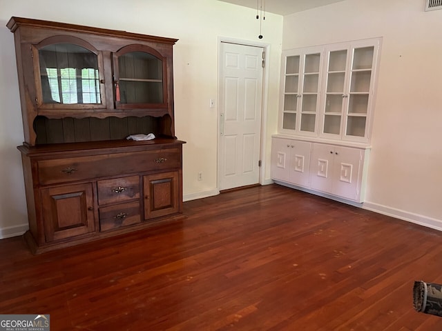 interior space featuring dark wood-type flooring