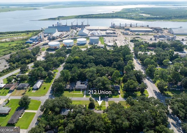 birds eye view of property with a water view