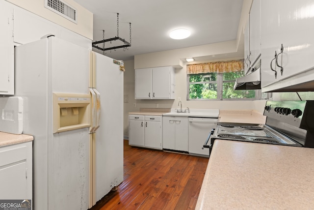 kitchen with sink, white cabinets, dark hardwood / wood-style floors, and white appliances