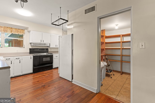 kitchen featuring white cabinetry, electric range, light hardwood / wood-style floors, and white refrigerator