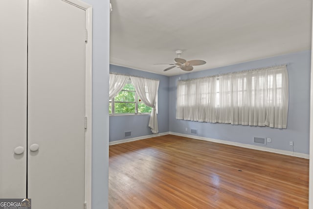 spare room featuring ceiling fan and wood-type flooring