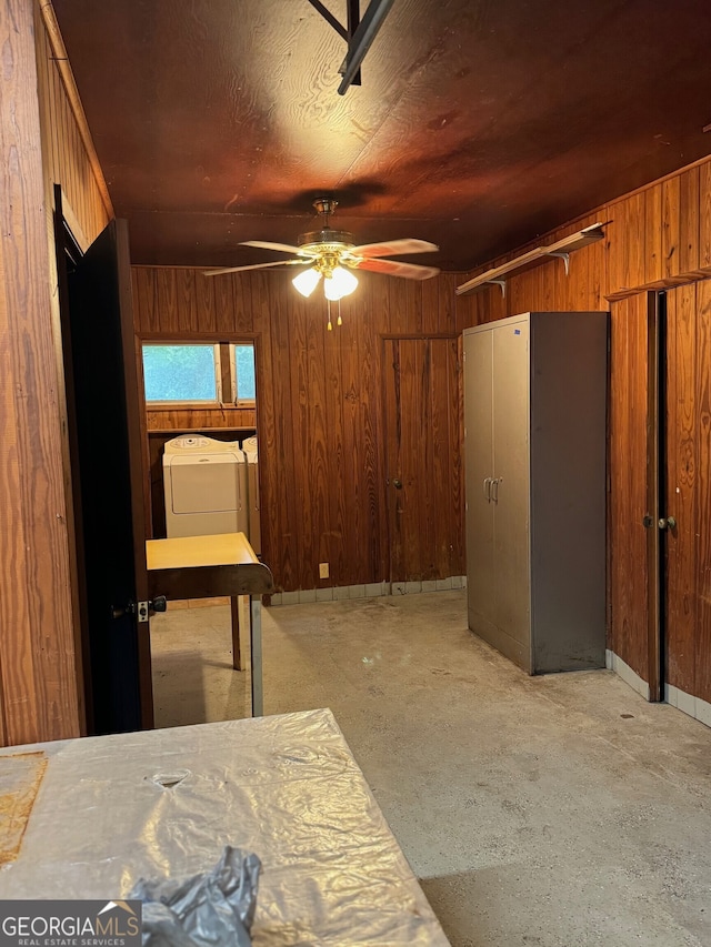 bedroom with wooden walls and ceiling fan