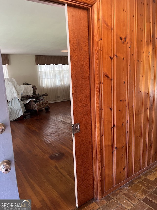 hallway featuring dark wood-type flooring