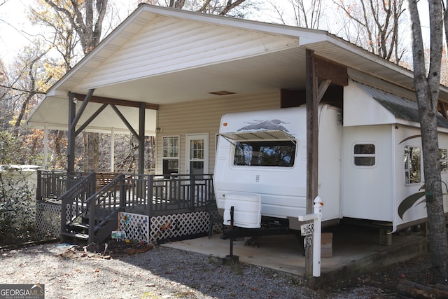 exterior space with a carport