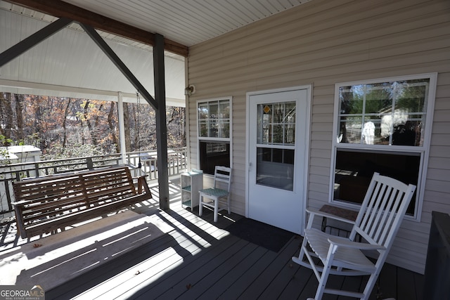 wooden terrace featuring a porch