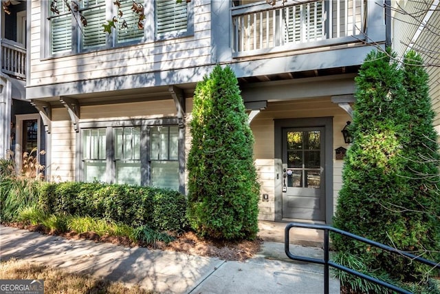 entrance to property with a balcony