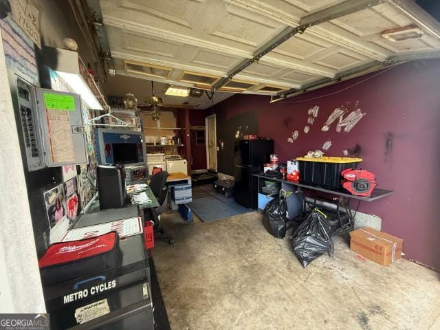 garage featuring black fridge