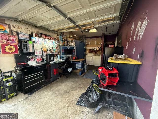 garage featuring washing machine and dryer