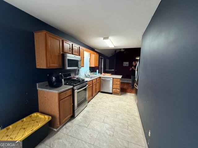 kitchen with appliances with stainless steel finishes and sink