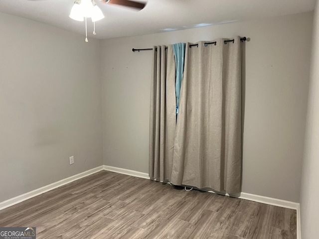 spare room featuring ceiling fan and wood-type flooring