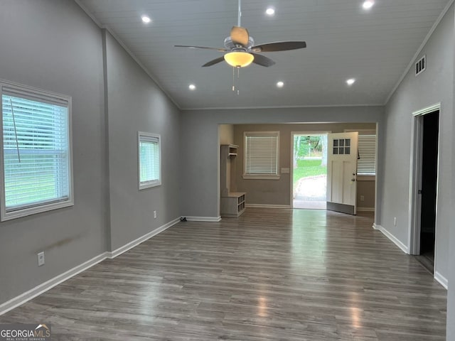 unfurnished living room with ceiling fan, wooden ceiling, dark wood-type flooring, high vaulted ceiling, and ornamental molding