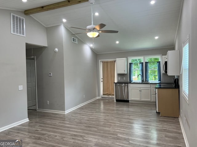 kitchen featuring dishwasher, beamed ceiling, white cabinets, and light hardwood / wood-style floors