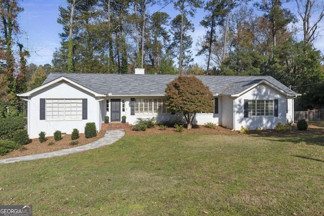 ranch-style home featuring a front yard