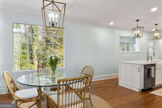 dining room featuring dark hardwood / wood-style floors, a healthy amount of sunlight, and sink