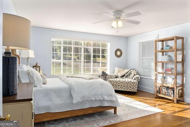 bedroom featuring hardwood / wood-style floors and ceiling fan