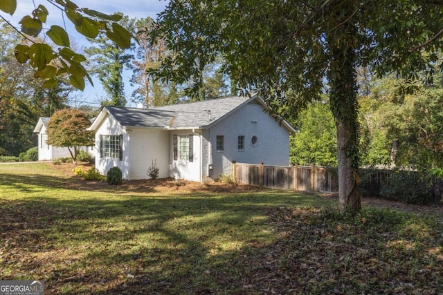 view of home's exterior featuring a yard