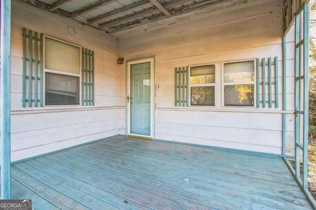 wooden terrace with covered porch